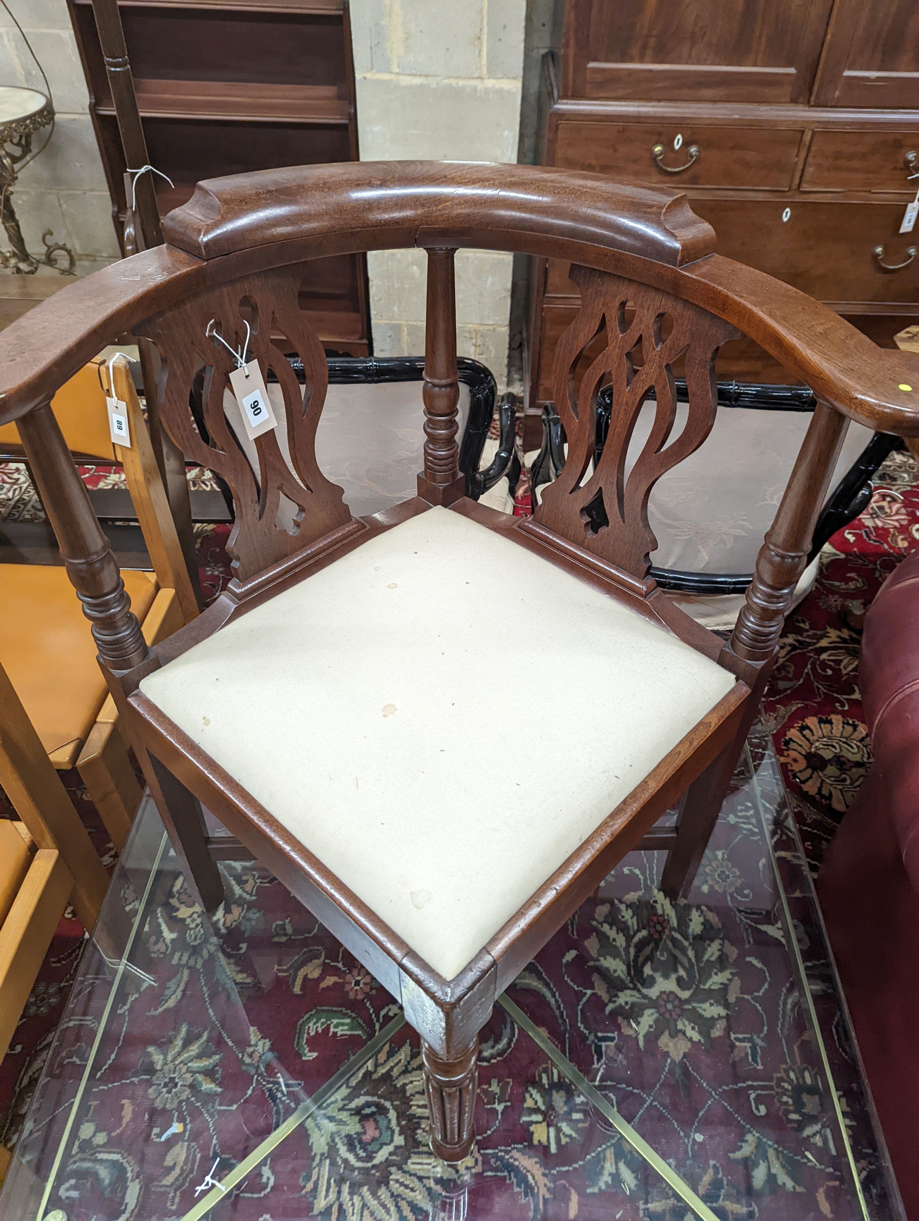 A George III mahogany corner elbow chair, width 76cm, depth 64cm, height 81cm